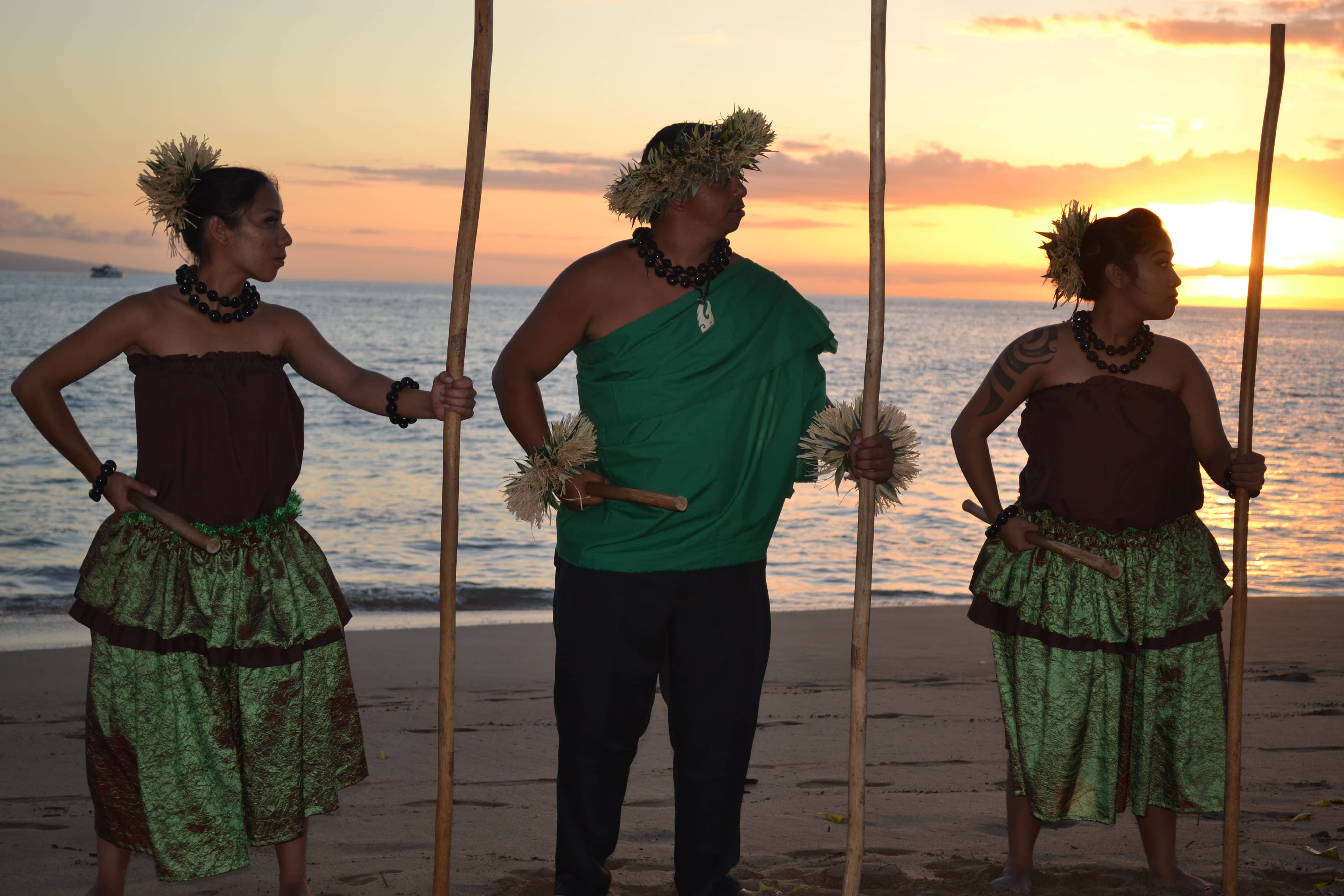 Huakaʻi Lūʻau performers at sunset on Kāʻanapali Beach, Maui